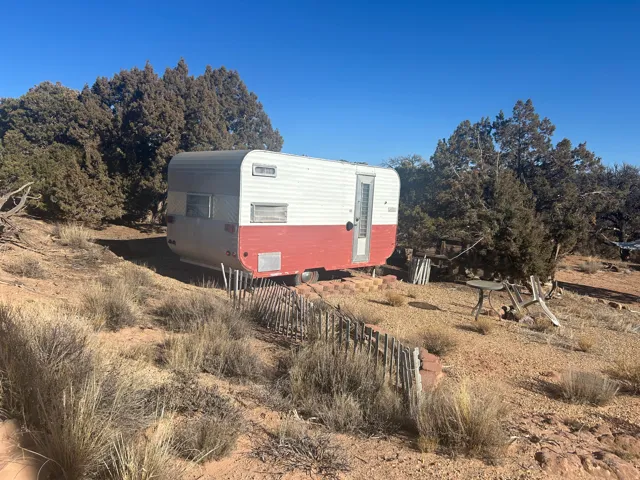 View of side of property featuring an outbuilding