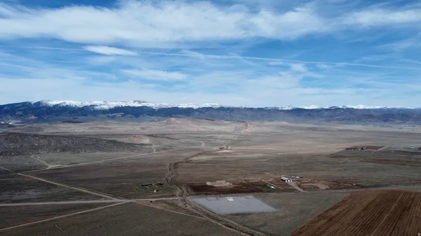 View of mountain backdrop with rural landscape