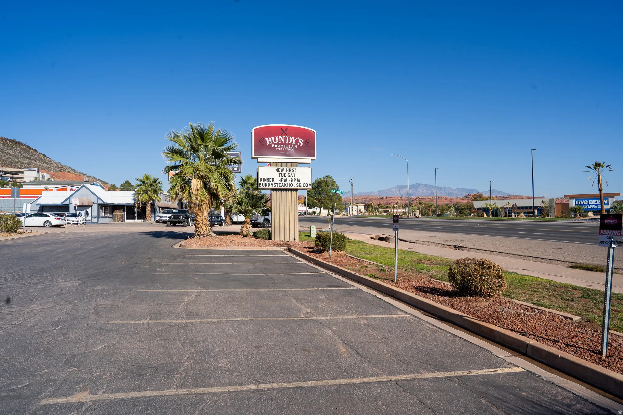 Uncovered parking lot with a mountain view