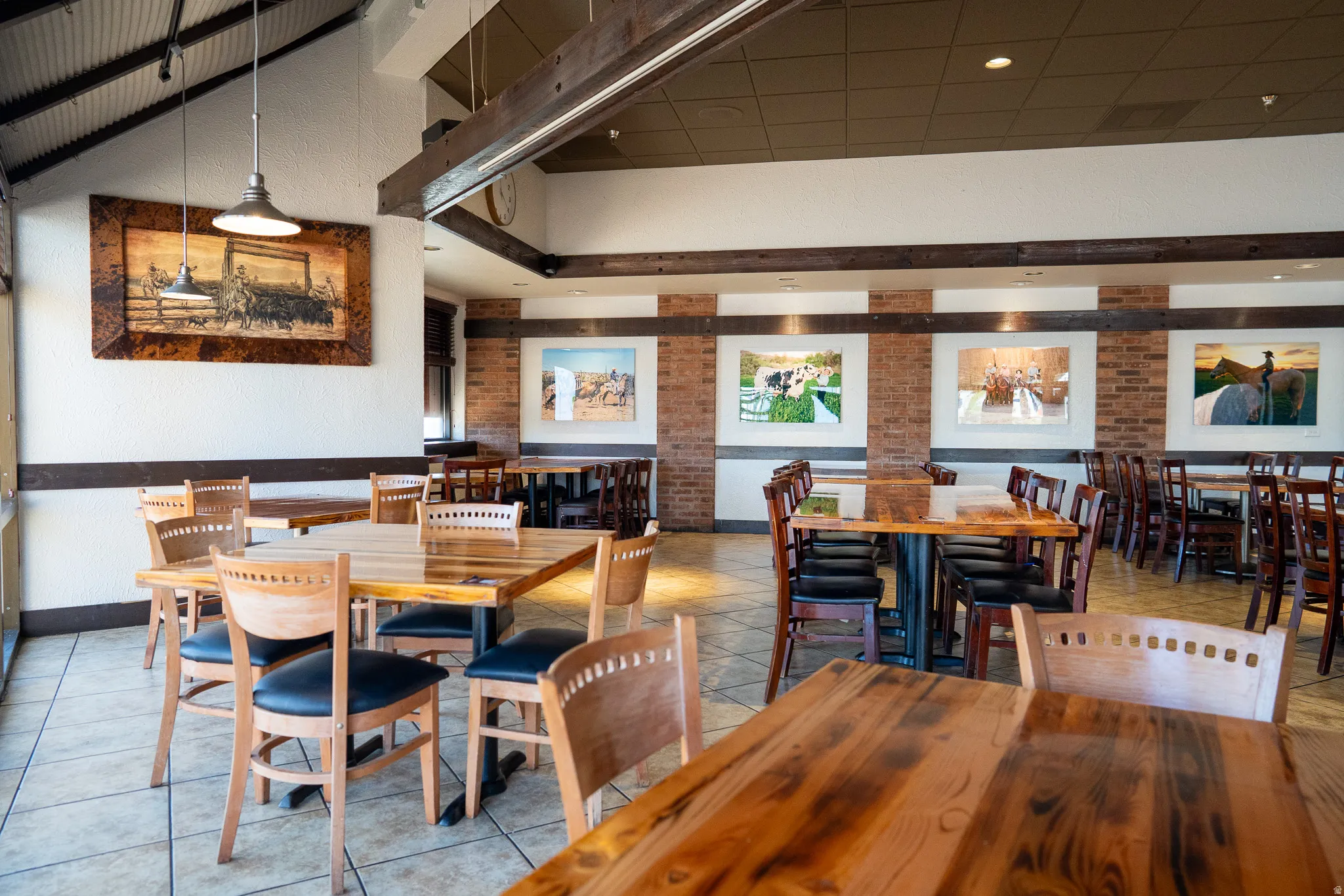 Dining area with brick wall and tile patterned floors