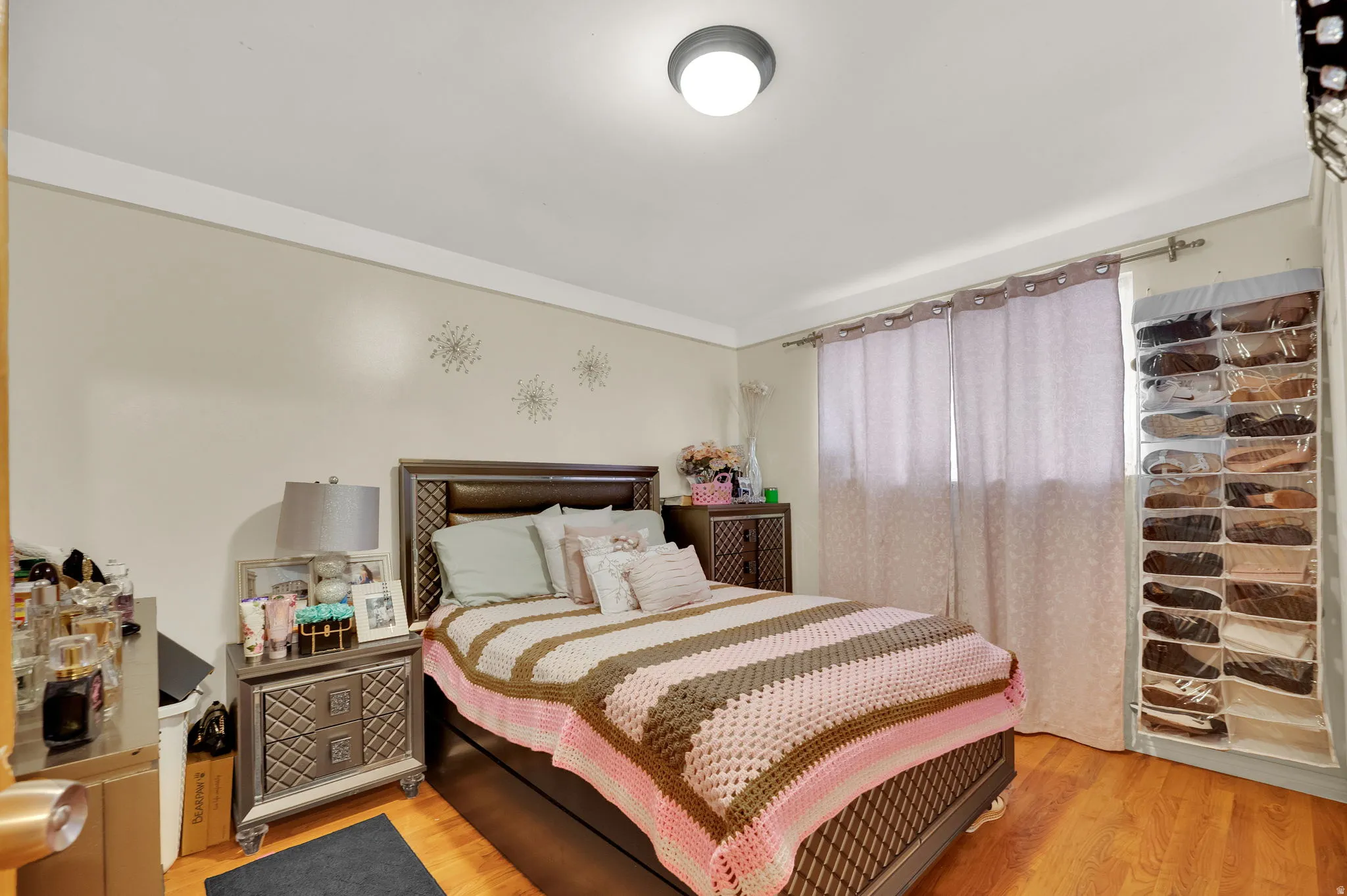 Bedroom with light wood-style floors