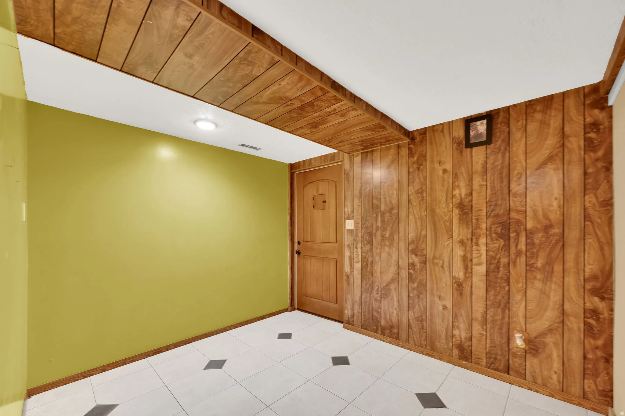 Empty room featuring wooden walls