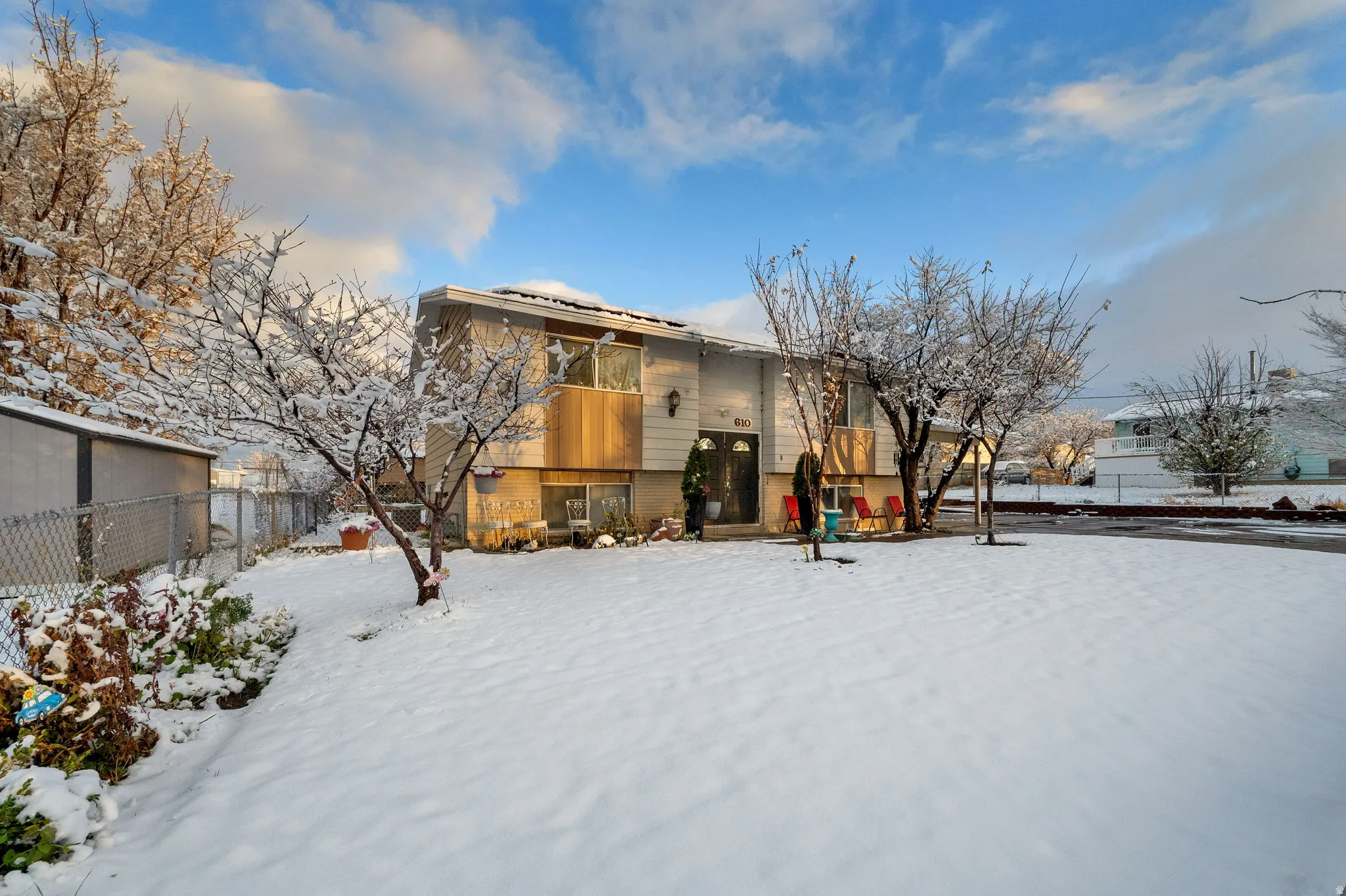 Snow covered house featuring a balcony