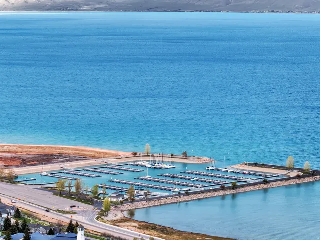 Expansive waterfront setting featuring a modern marina with numerous boat slips
