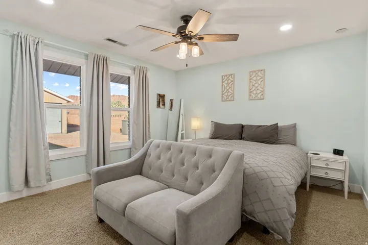 Bedroom featuring recessed lighting, a ceiling fan, and carpet
