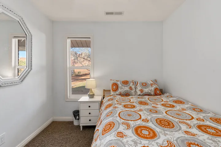 Bedroom featuring baseboards and carpet flooring