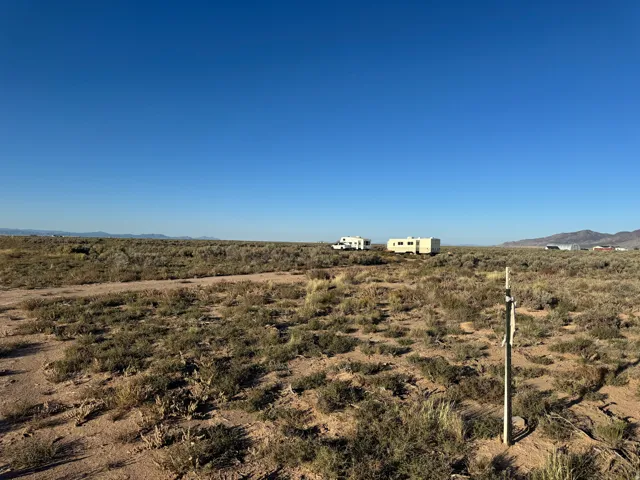View of yard with a mountain view and a view of rural / pastoral area