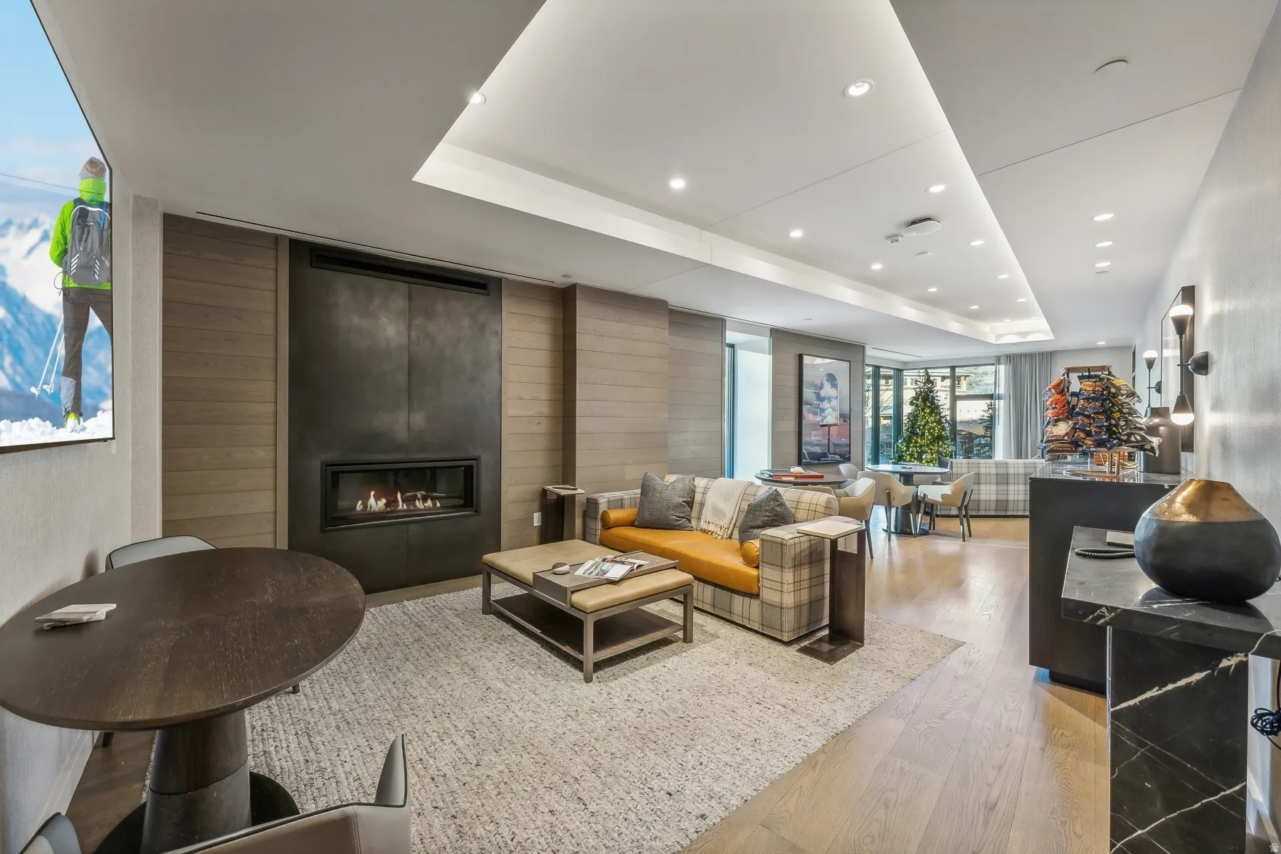 Common area featuring wooden walls and recessed lighting