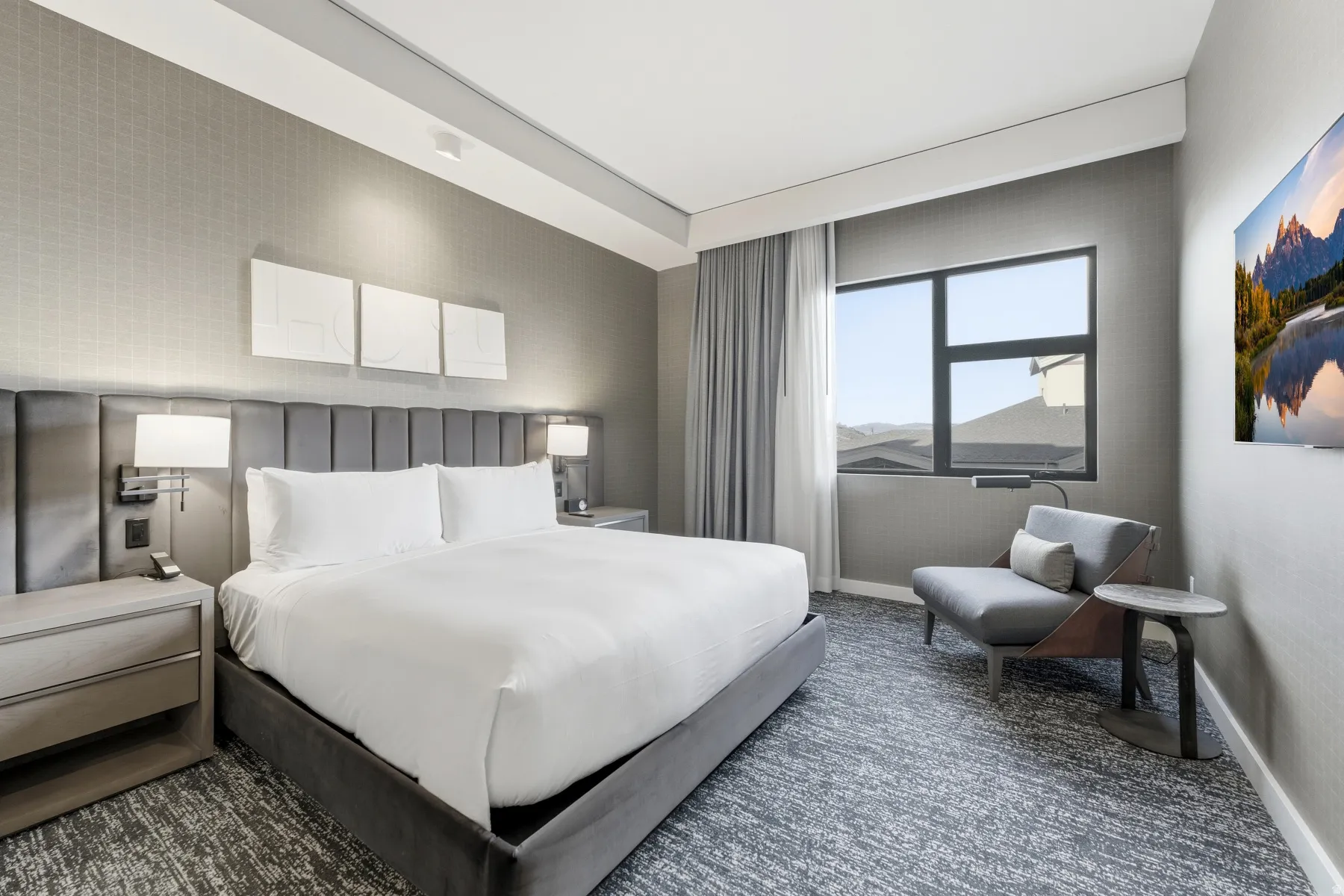 Bedroom featuring dark colored carpet and baseboards