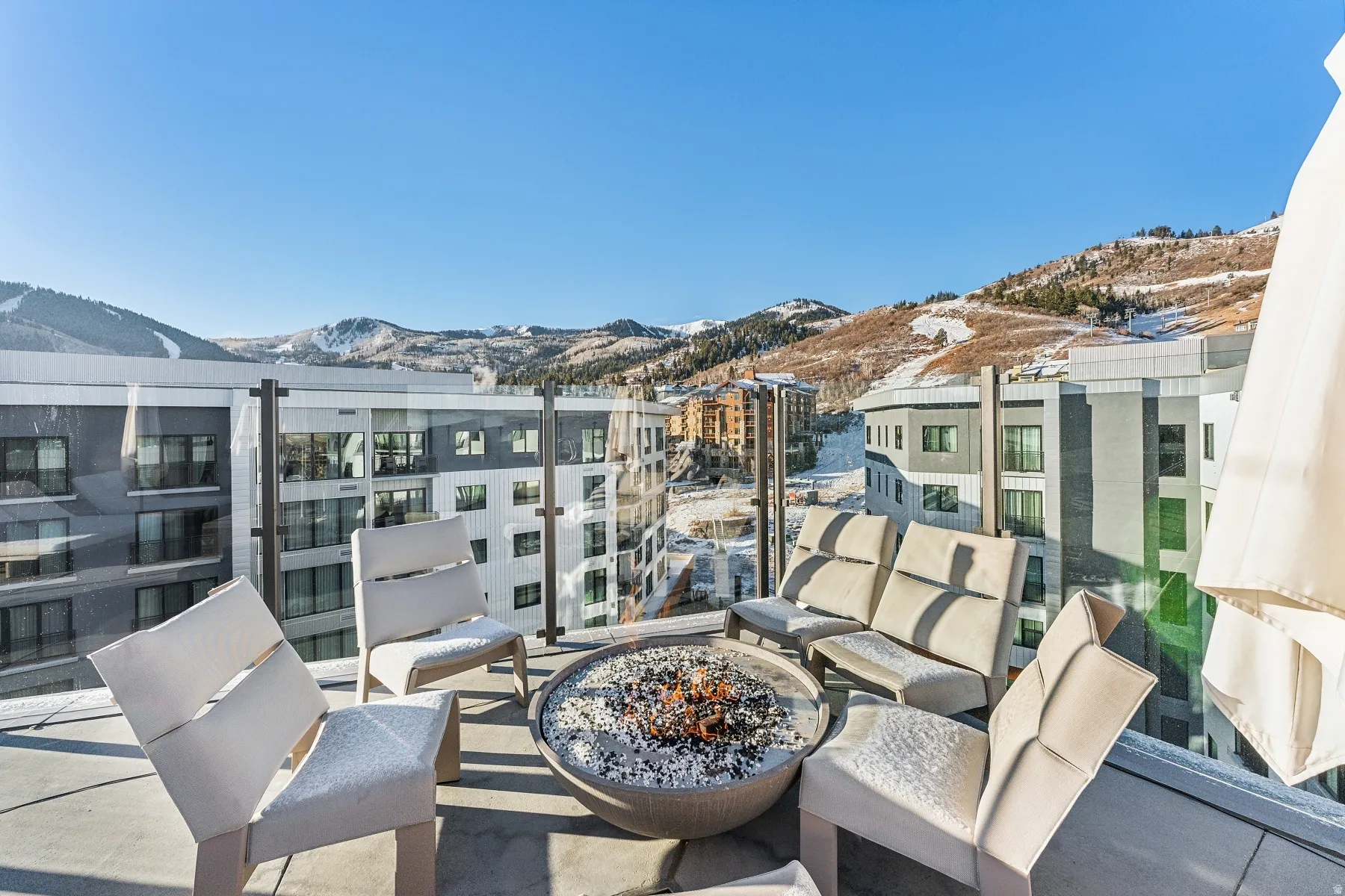 Balcony featuring a mountain view and an outdoor living space with a fire pit