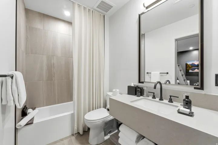 Full bathroom with shower / bath combination with curtain, vanity, and recessed lighting
