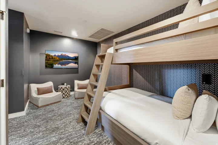 Bedroom featuring carpet flooring and baseboards
