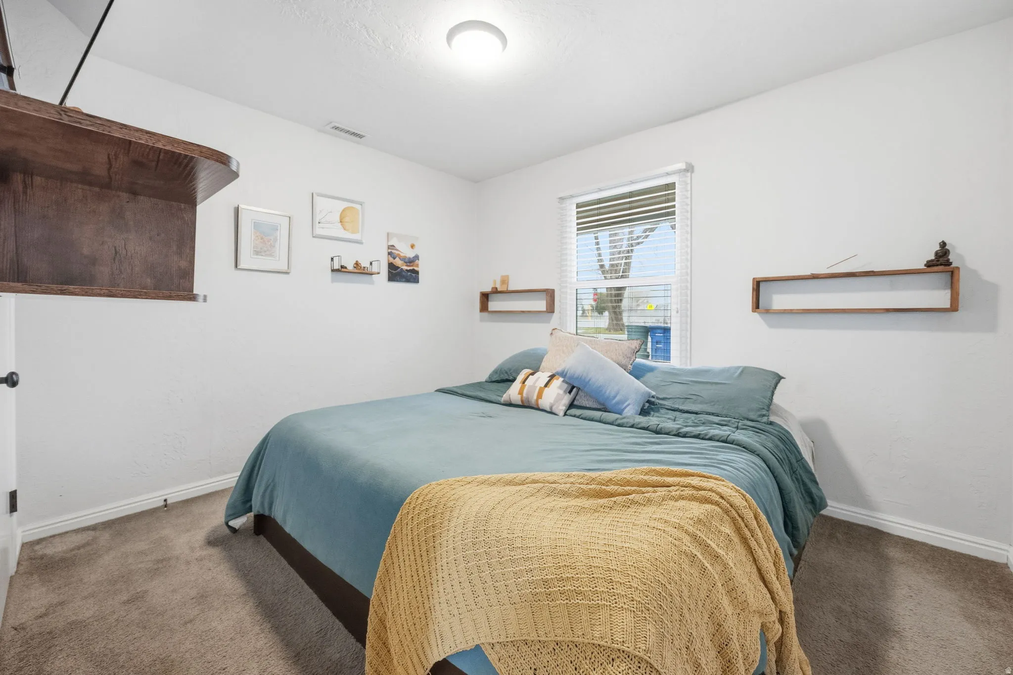 Bedroom with baseboards and carpet flooring