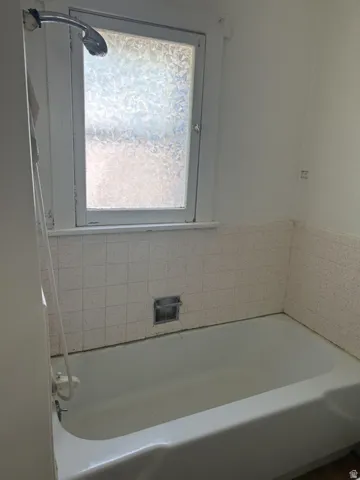 Bathroom featuring a tub