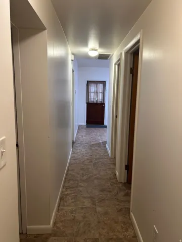 Hall featuring baseboards
