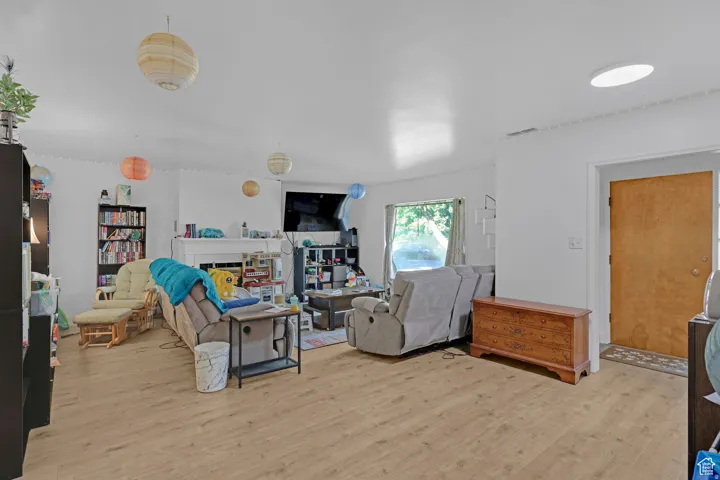 Living room featuring light wood-style floors