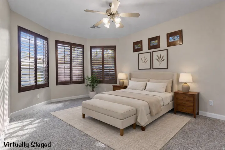 Casita with a ceiling fan and multiple windows. Virtually staged.