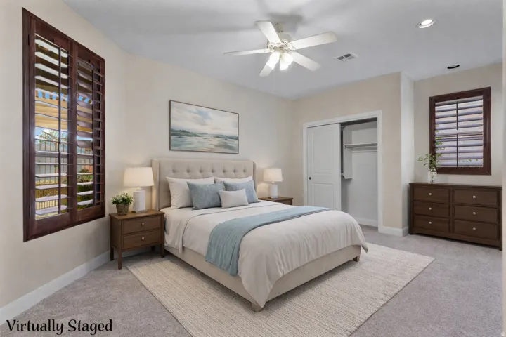 Bedroom featuring multiple windows, carpet flooring, a ceiling fan, and recessed lighting