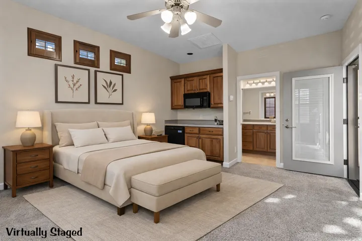 Casita featuring a ceiling fan and ensuite bathroom. Virtually Staged.
