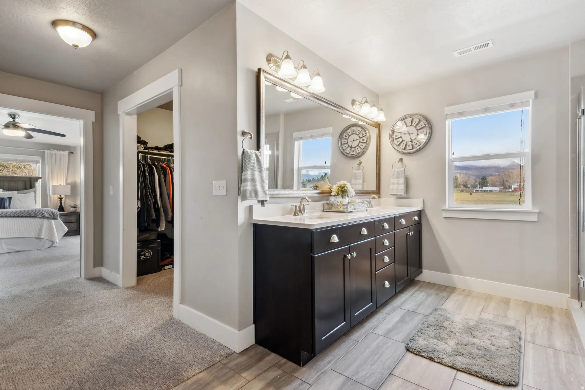 Primary bathroom featuring double vanity, and a spacious close
