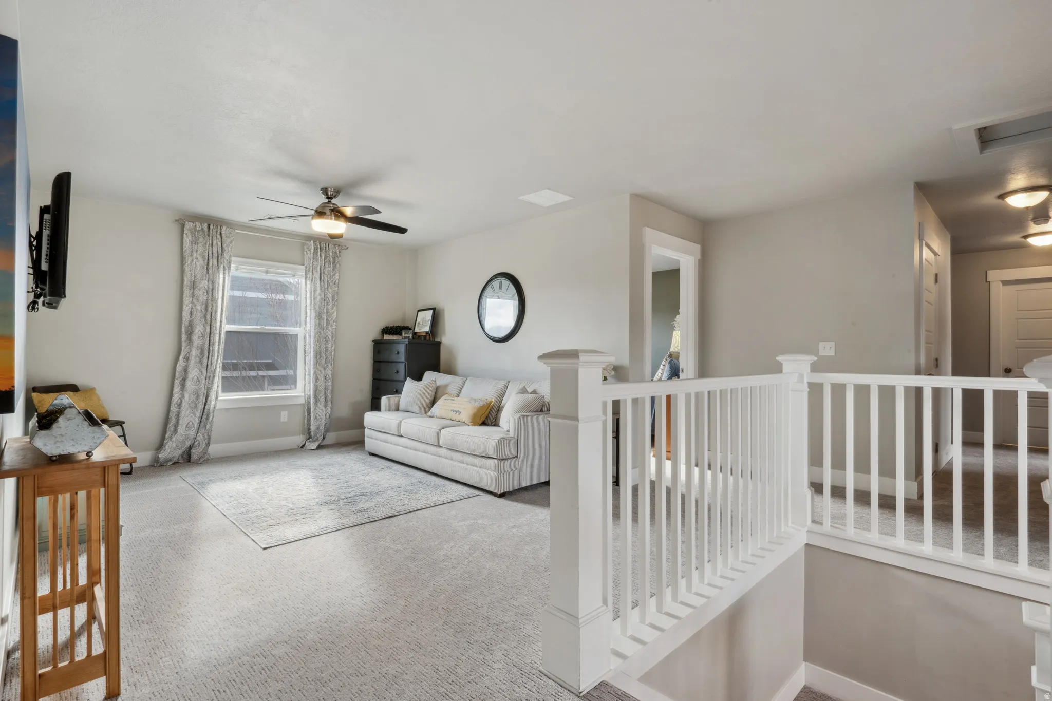 Upstairs living area with carpet floors