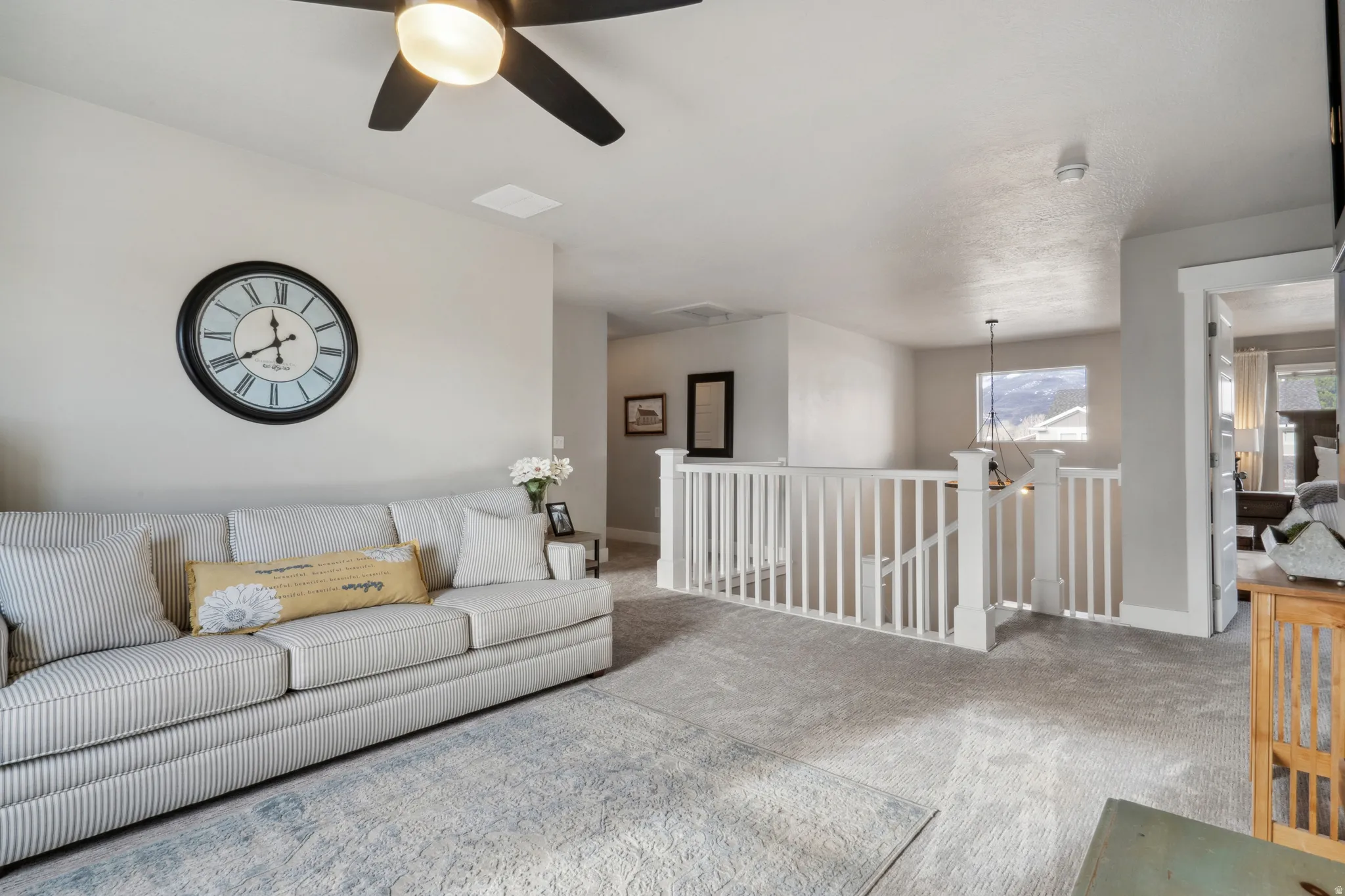 Upstairs living room with carpet and a chandelier