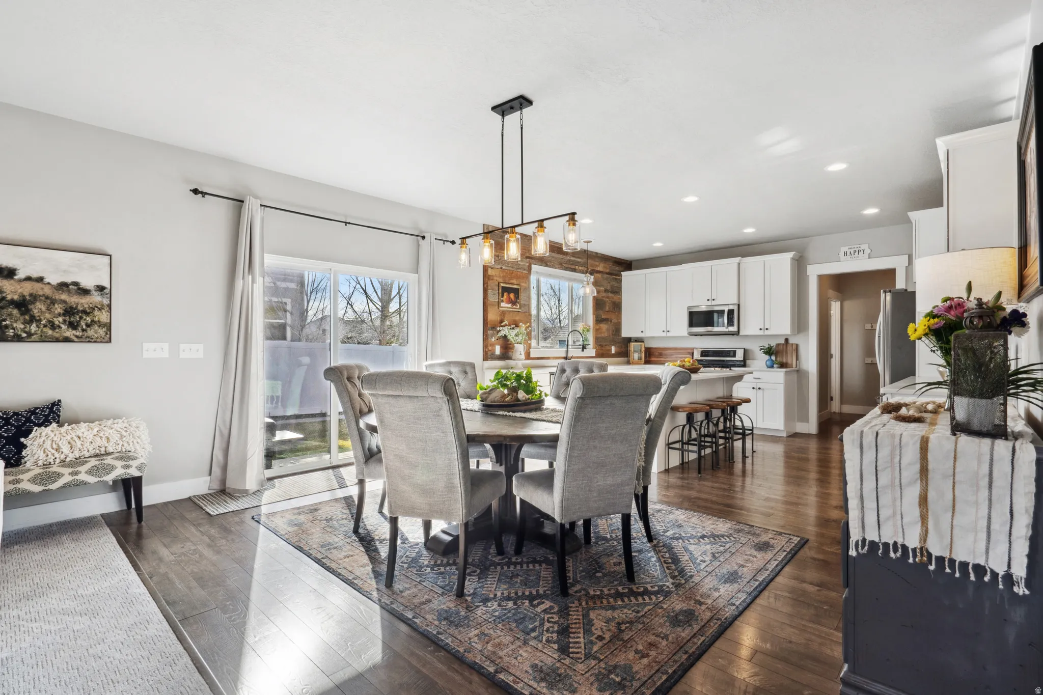 Dining room featuring dark wood finished floors and recessed lighting