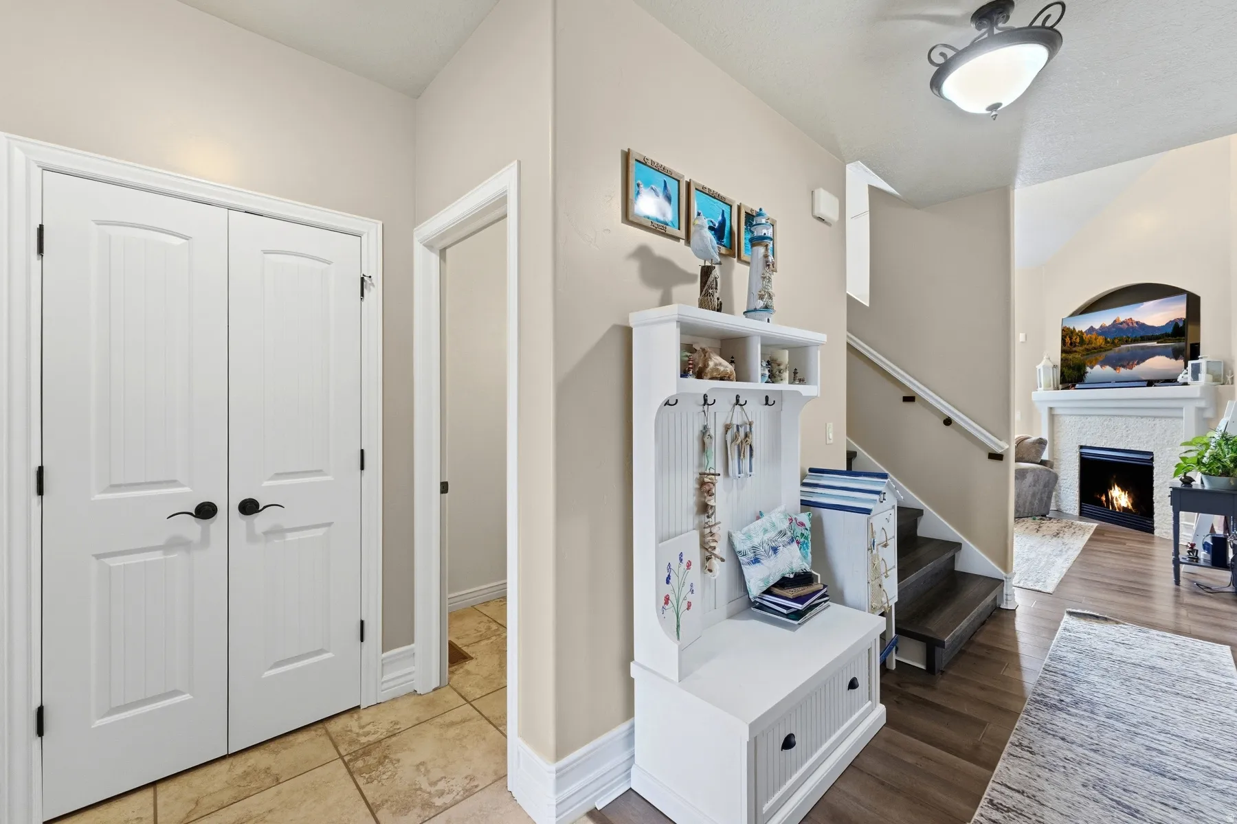 Corridor featuring stairway and wood finished floors
