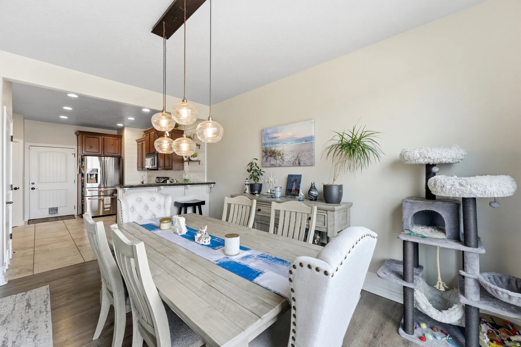 Dining space with recessed lighting and light wood-type flooring