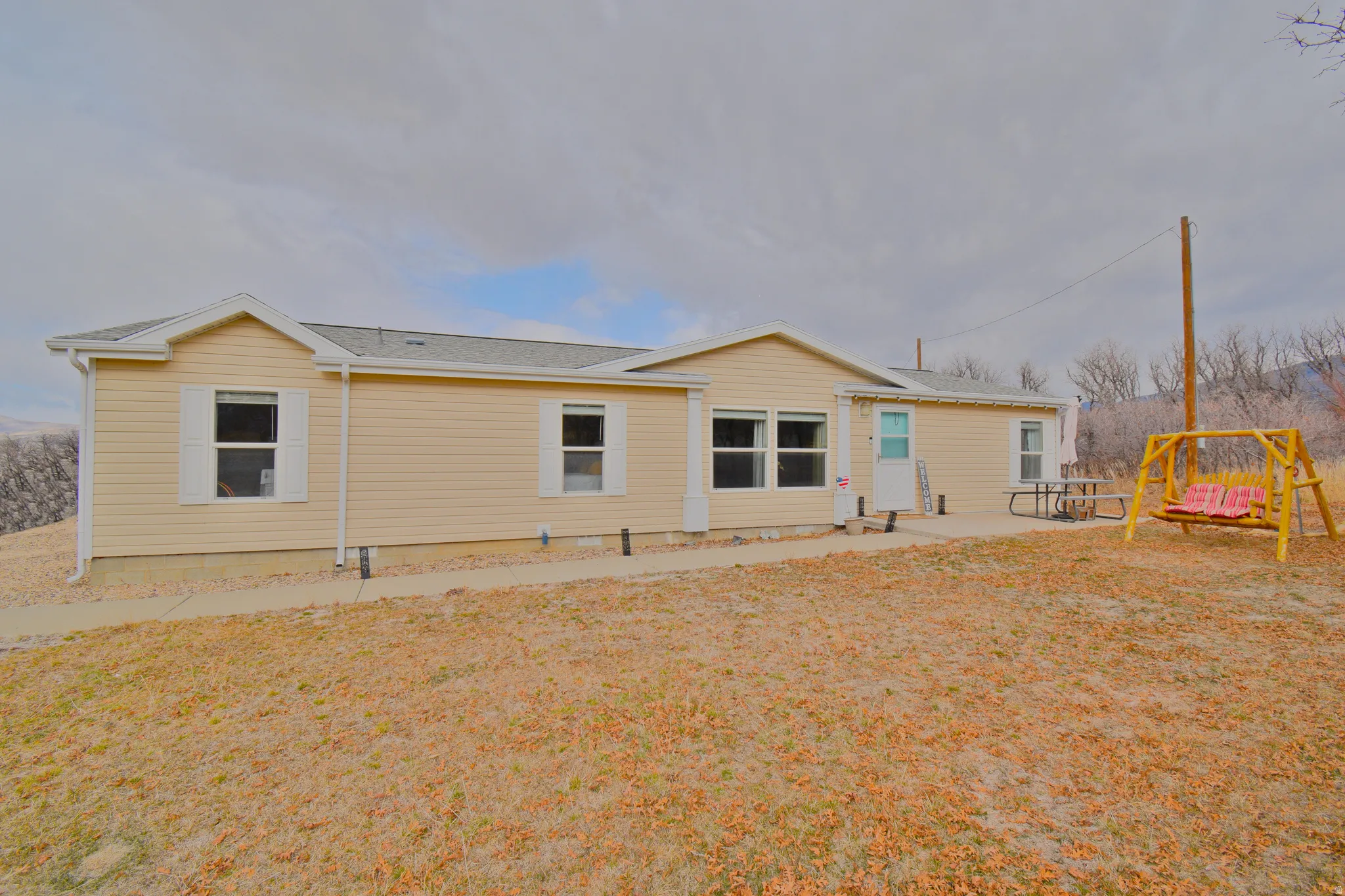 Front view of property with a patio