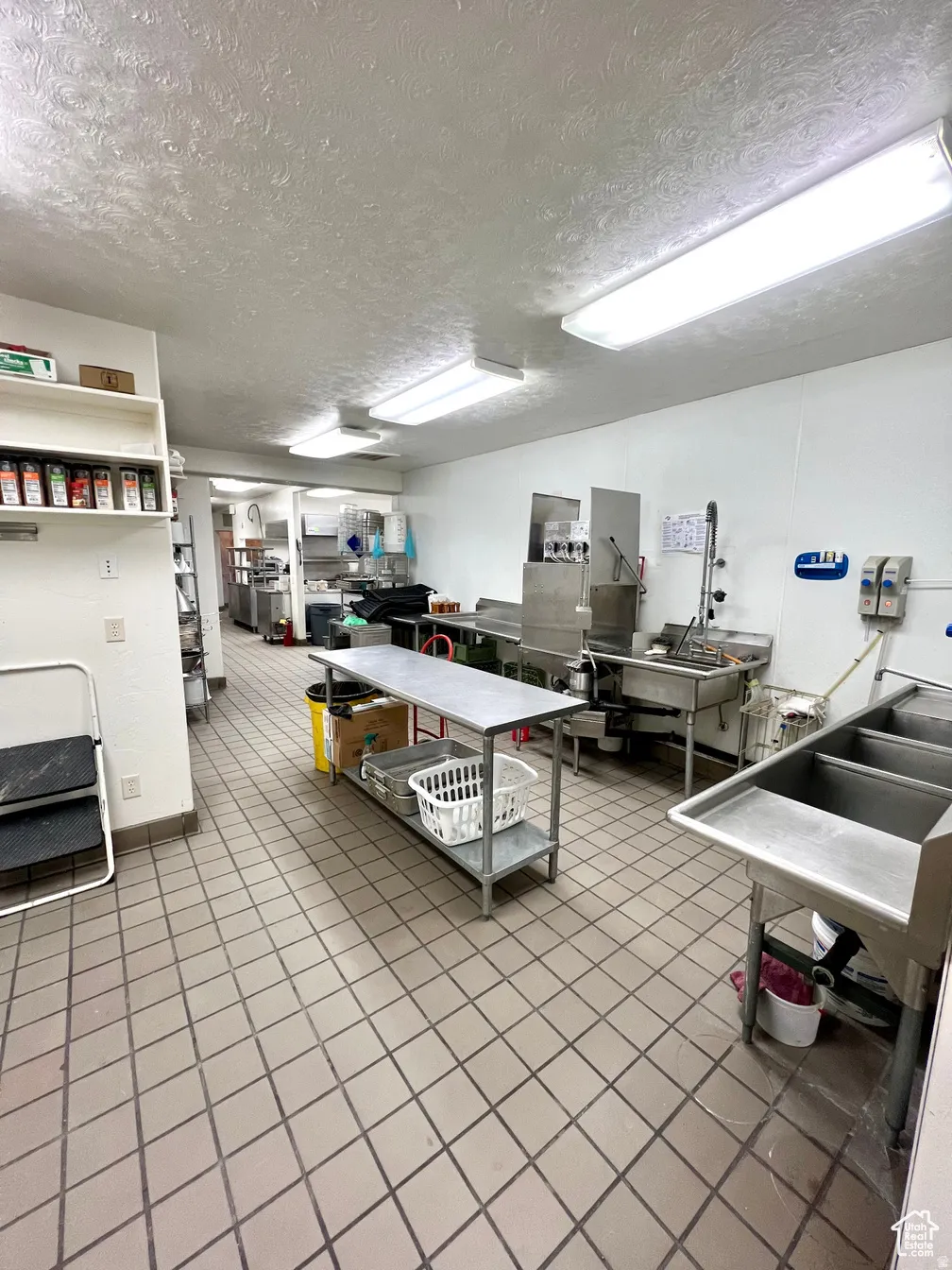 Miscellaneous room with a textured ceiling