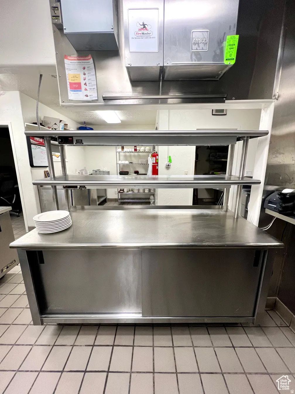 Kitchen featuring stainless steel countertops