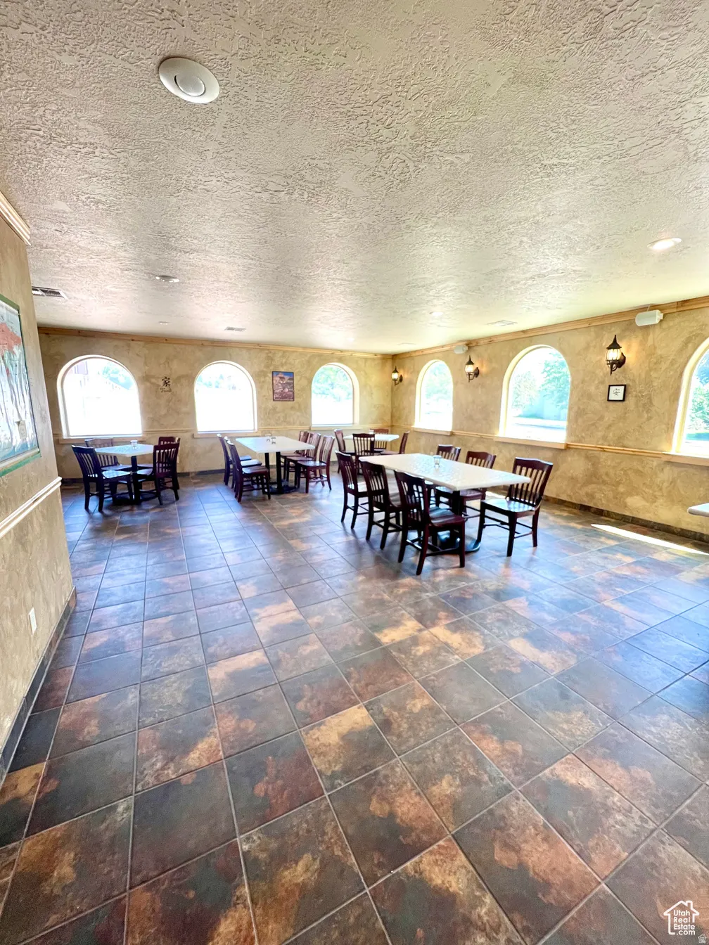 Dining area featuring a textured ceiling