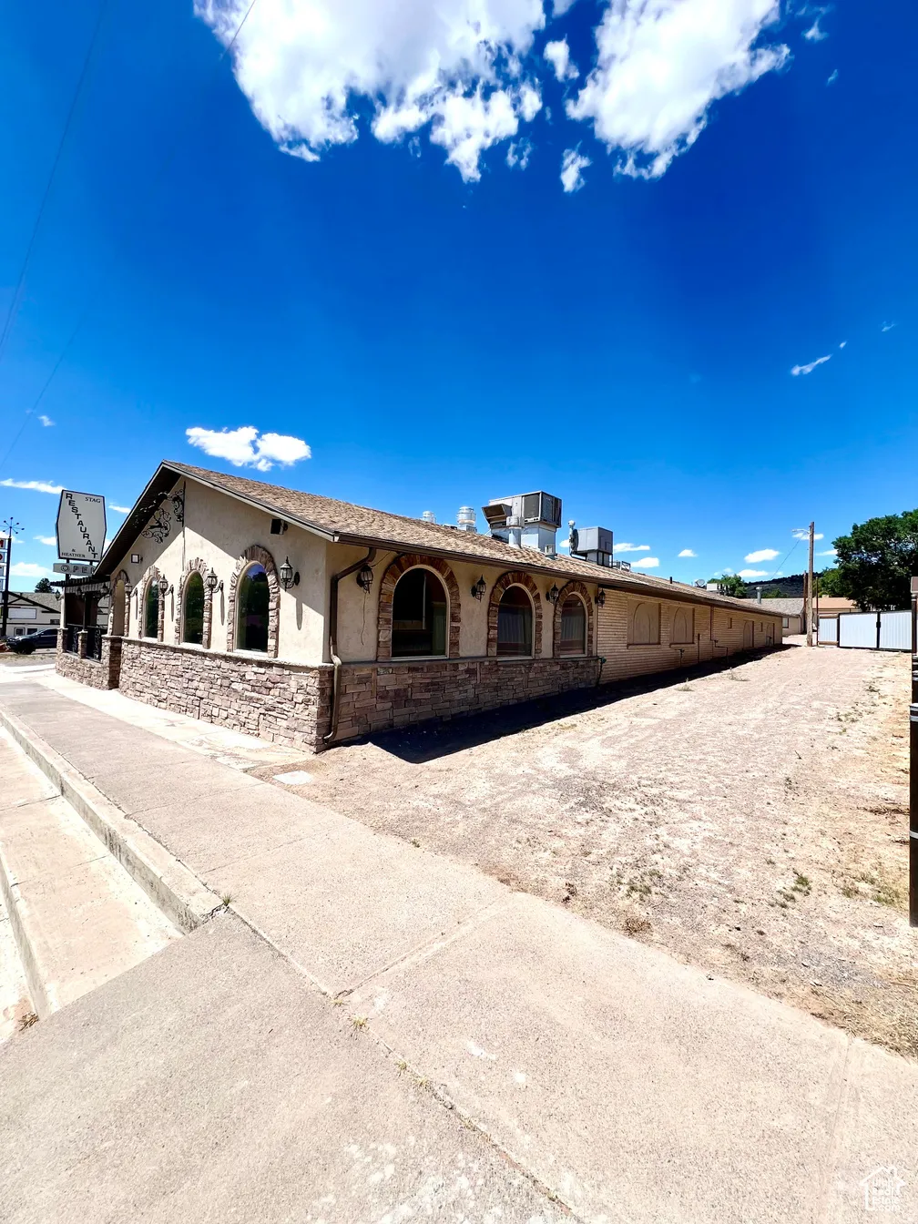 View of front of home with stone siding and stucco siding