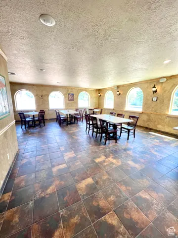 Dining area featuring a textured ceiling