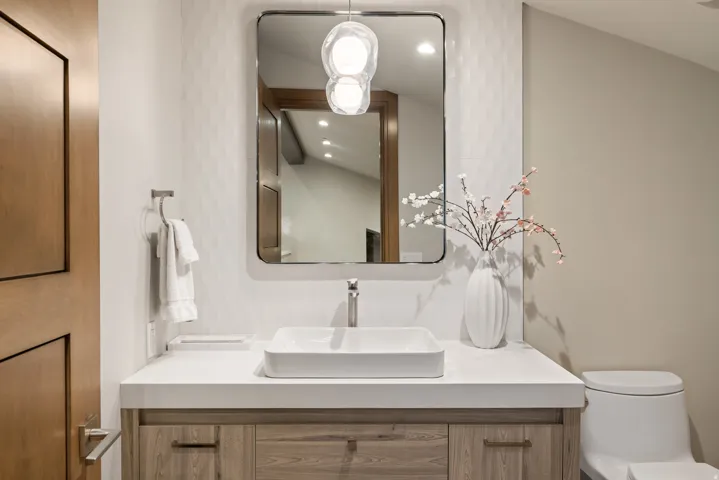 Bathroom with vanity and recessed lighting