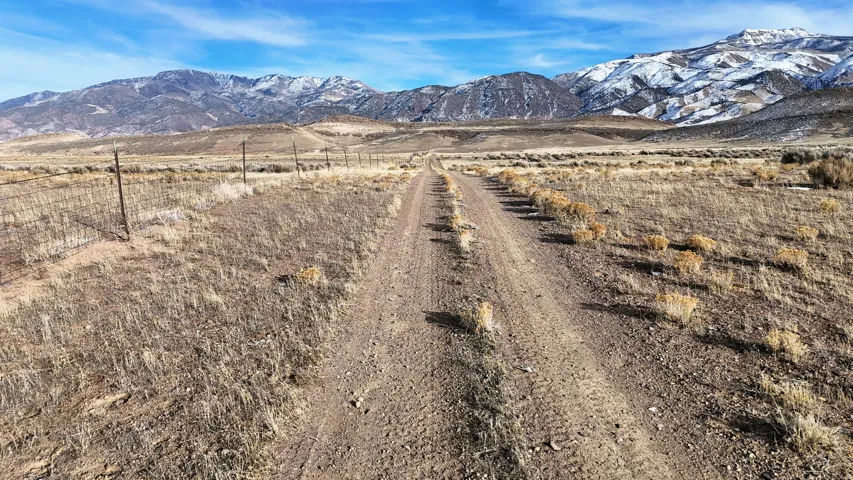 View of mountain background featuring rural landscape