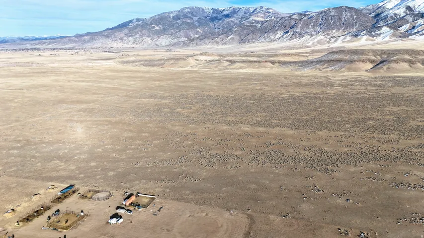 View of mountain backdrop featuring rural landscape and a desert landscape