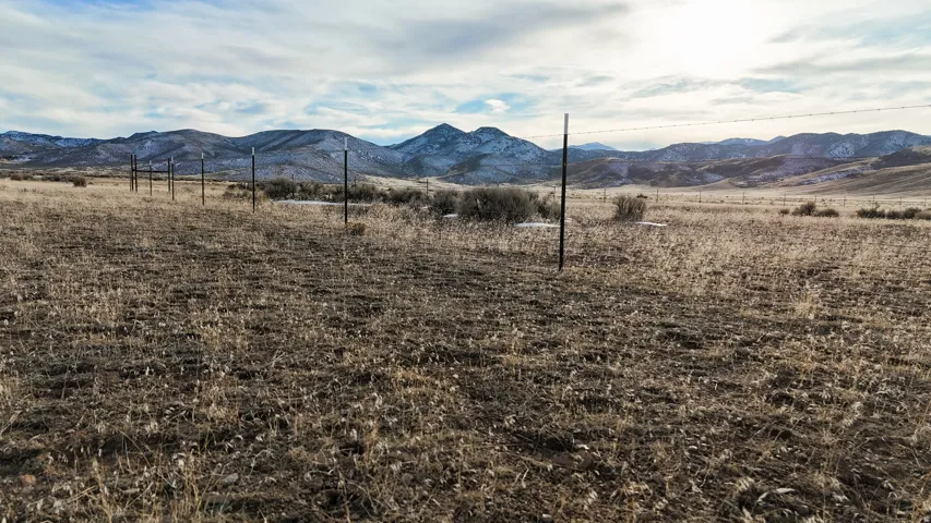 View of mountain background featuring rural landscape