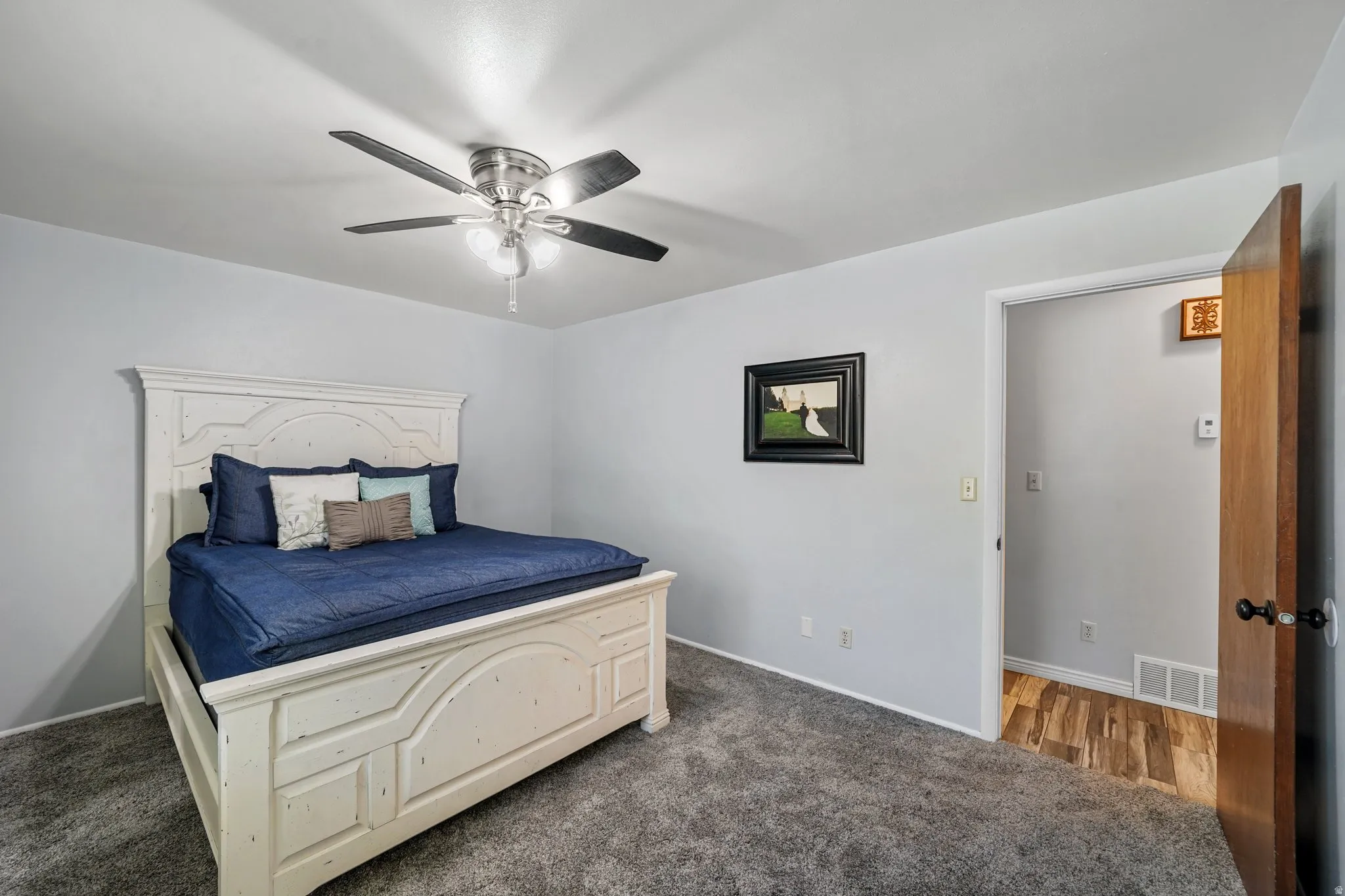 Bedroom featuring carpet flooring and ceiling fan