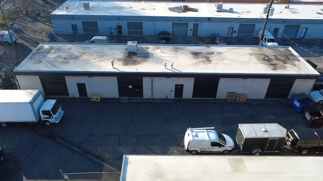 View of property with uncovered parking