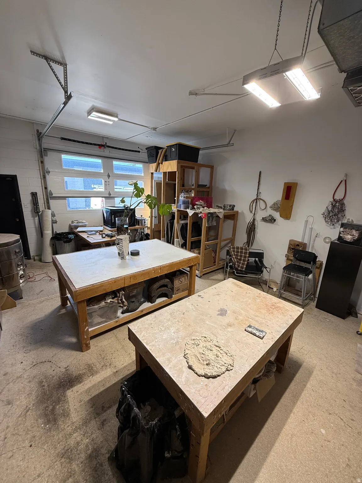 Dining space featuring a workshop area and concrete flooring
