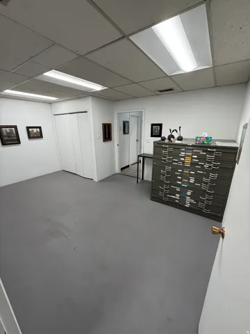 Finished basement featuring a paneled ceiling
