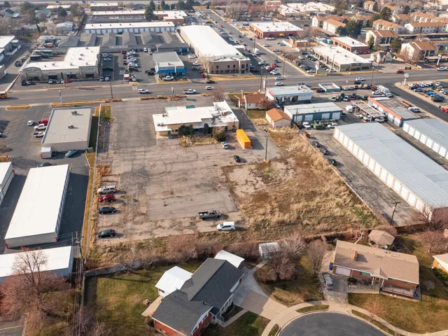 Aerial view of property's location featuring an industrial area
