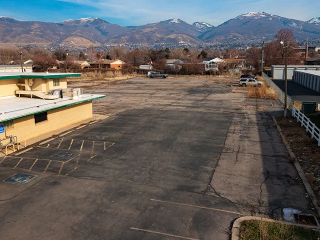 Aerial view of residential area featuring a mountain backdrop