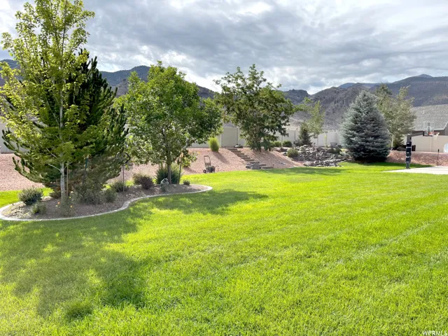 View of green lawn with a mountain view