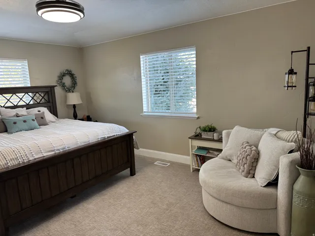 Carpeted bedroom with baseboards