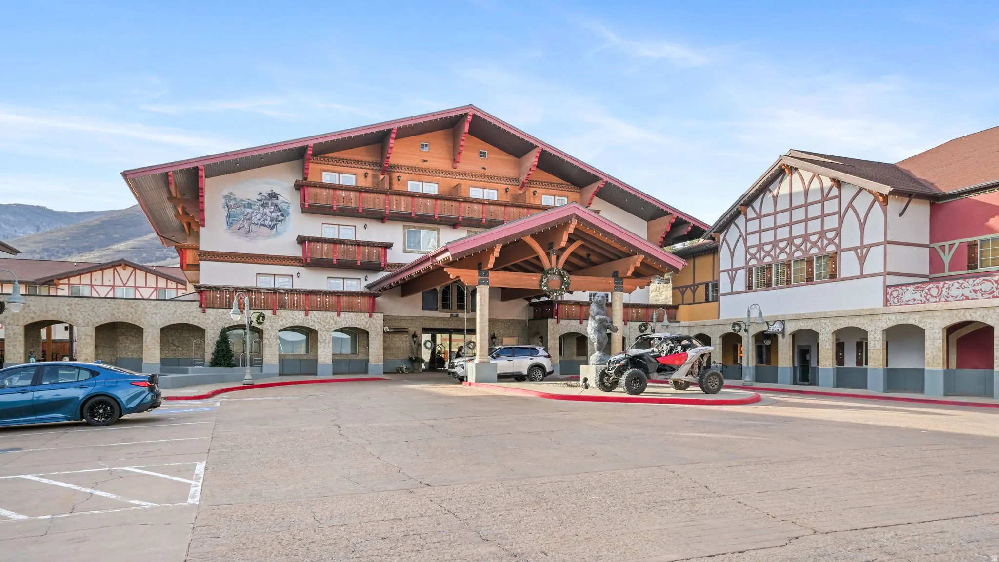 View of property featuring uncovered parking