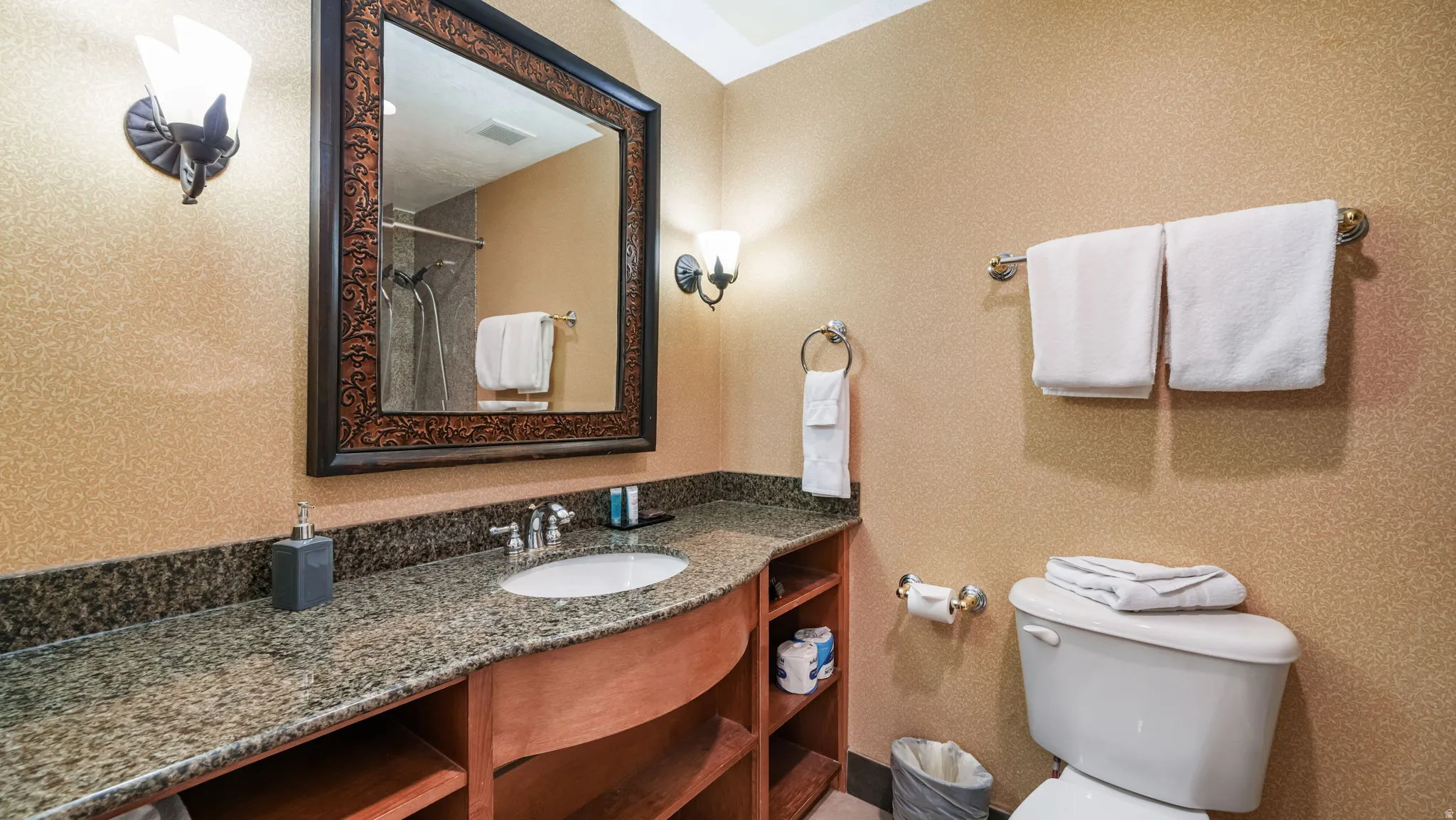 Full bathroom with curtained shower, vanity