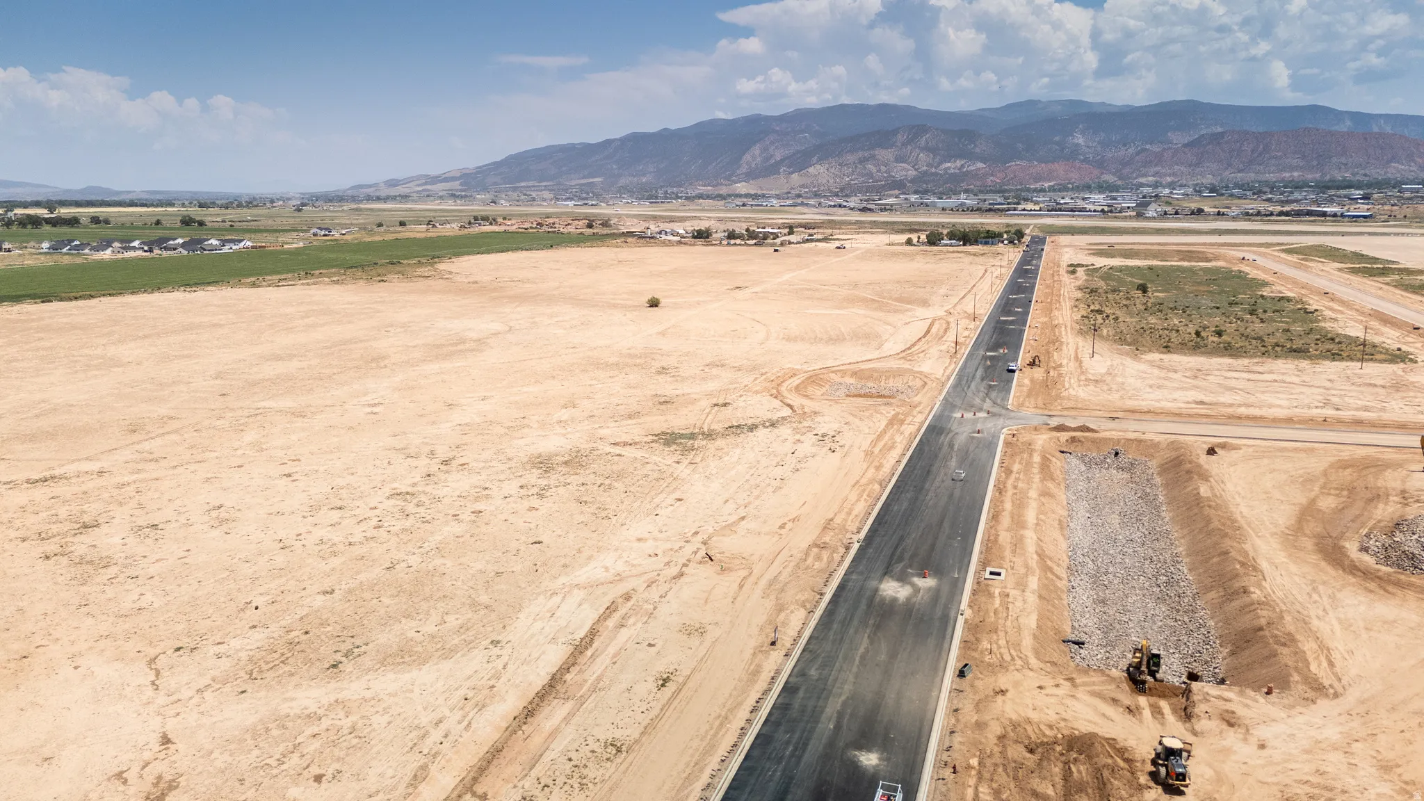 Aerial view of sparsely populated area with mountains